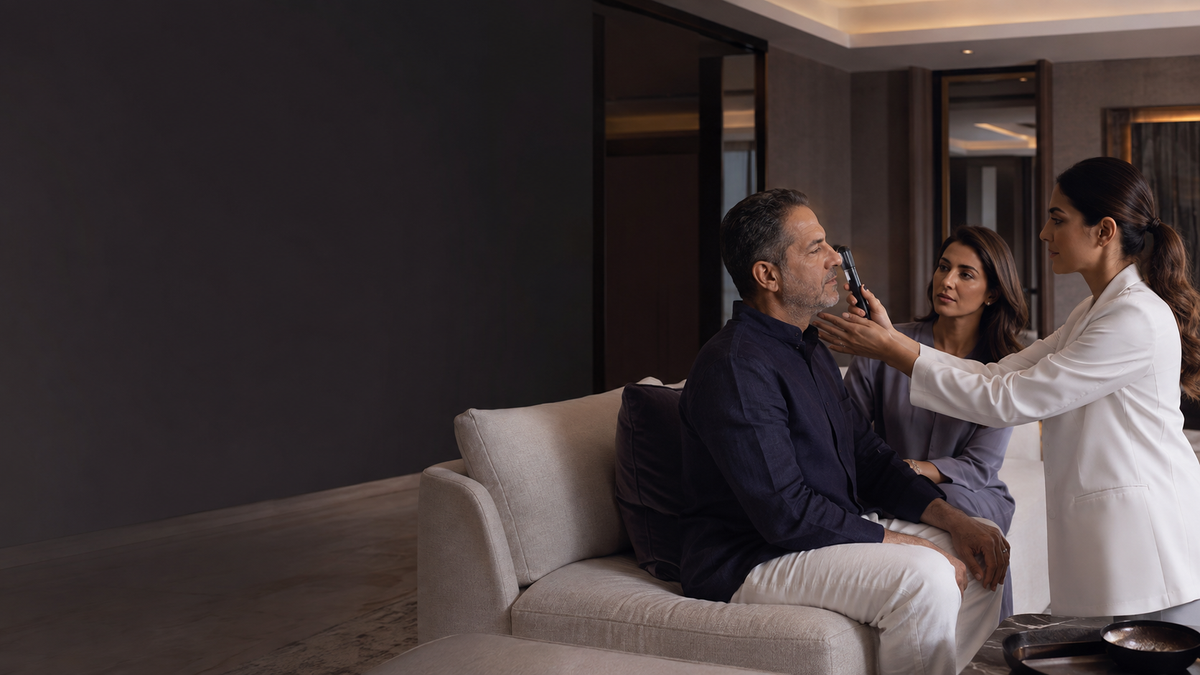 Doctor examining a patient during a private home visit in Dubai